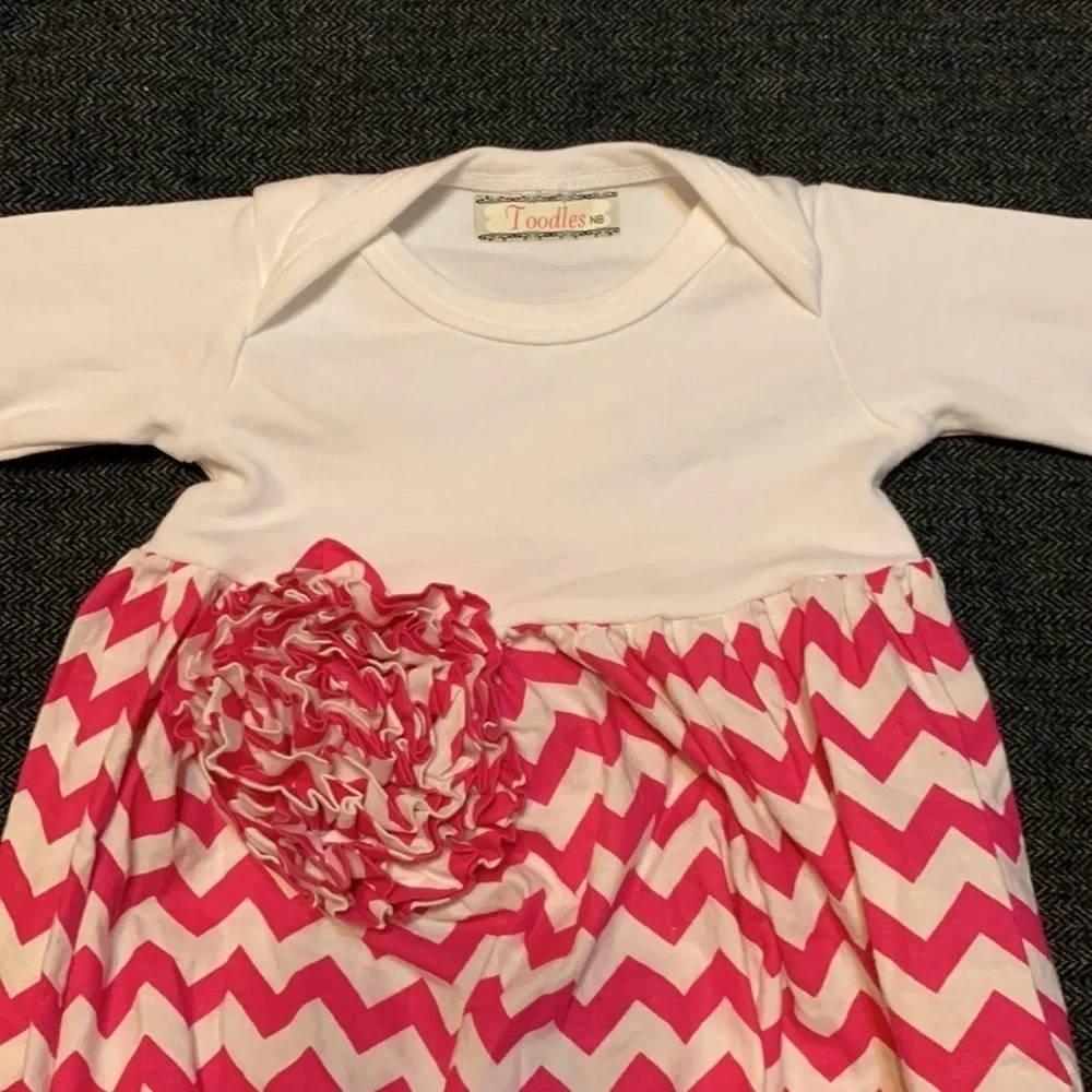 Toodles newborn gown with pink and white chevron print and flower